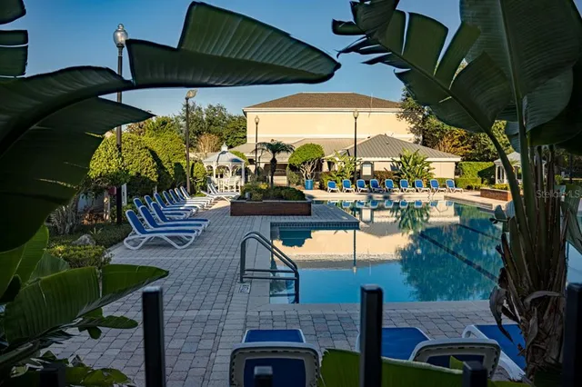 a view of a lake with houses in the background