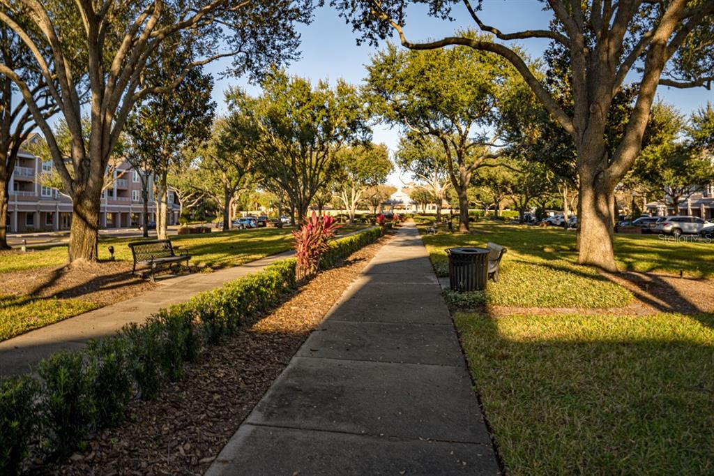 3468 Soho Street, Unit 303 Orlando, FL 32835 - Photo 20 of 21 a view of a swimming pool with lounge chair