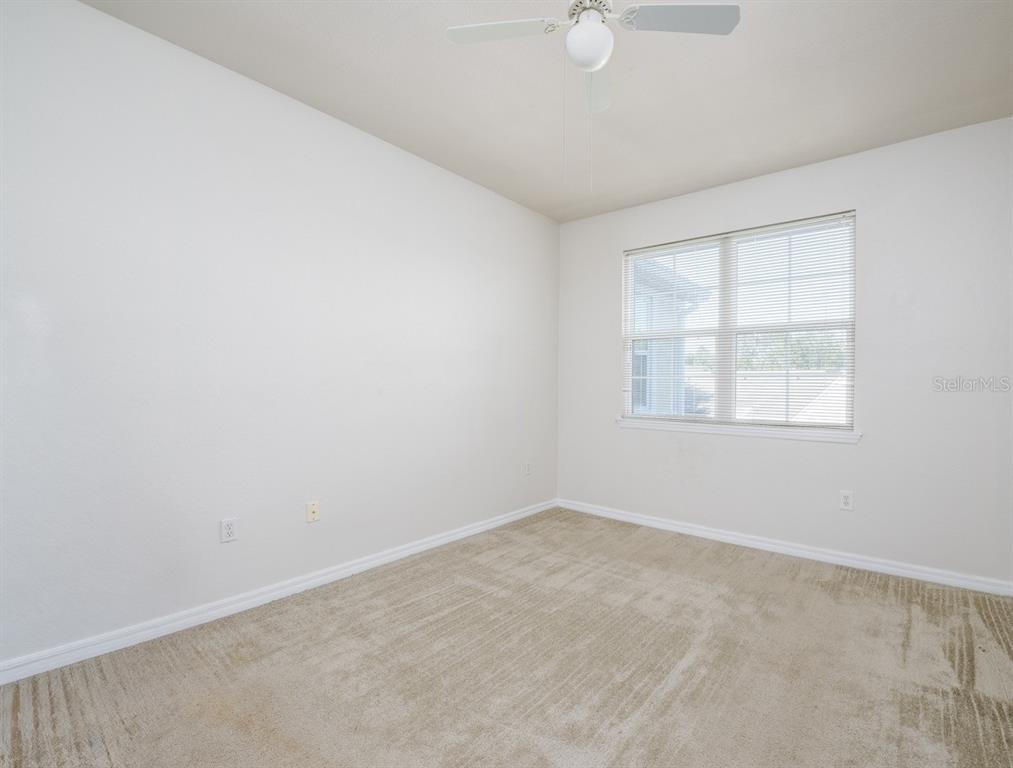 3468 Soho Street, Unit 303 Orlando, FL 32835 - Photo 9 of 21 an empty room with a window
