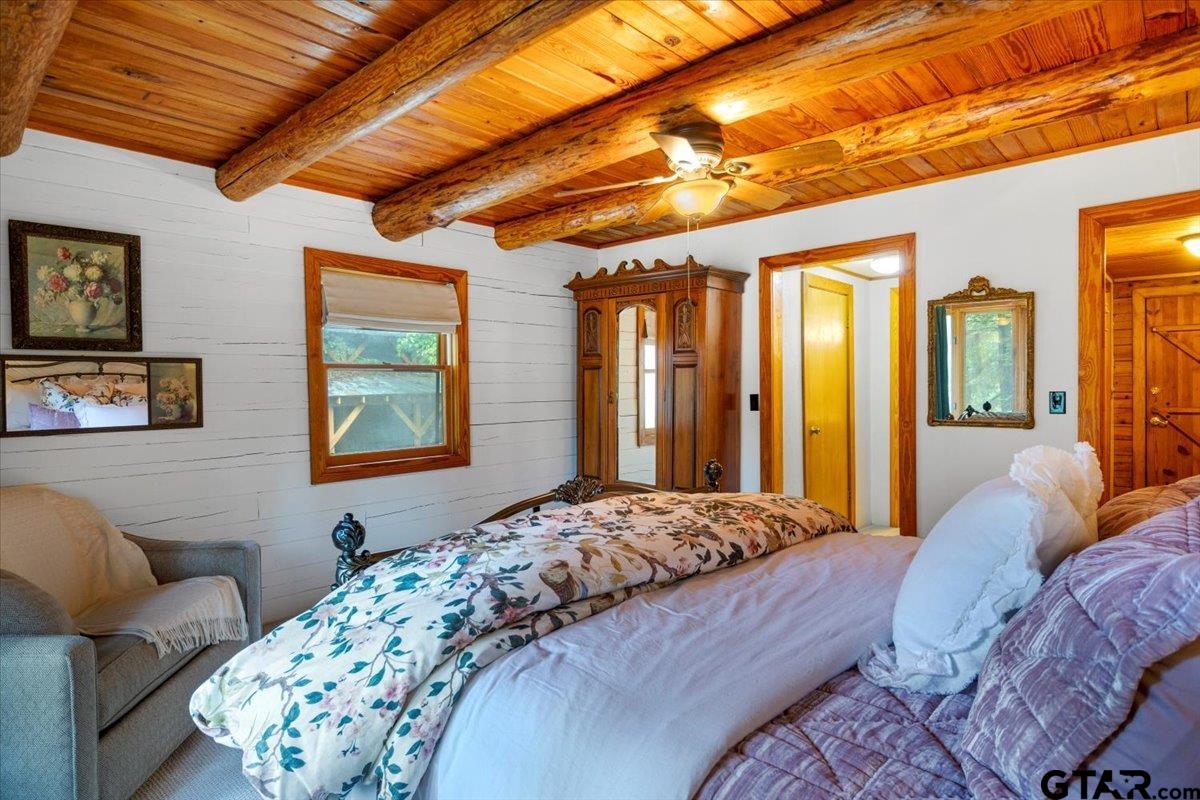 220 Dale Drive Avinger, TX 75630 - Photo 13 of 32 a bedroom with a bed next to a window