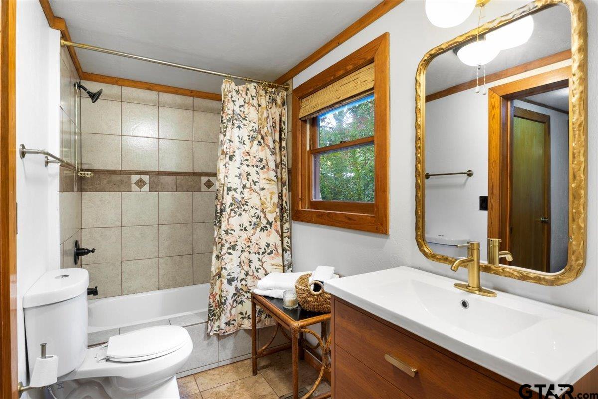 220 Dale Drive Avinger, TX 75630 - Photo 15 of 32 a bathroom with a sink and a mirror