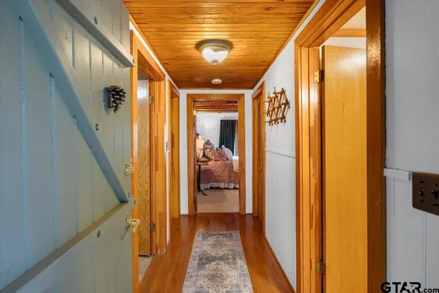 a bedroom with furniture and a rug