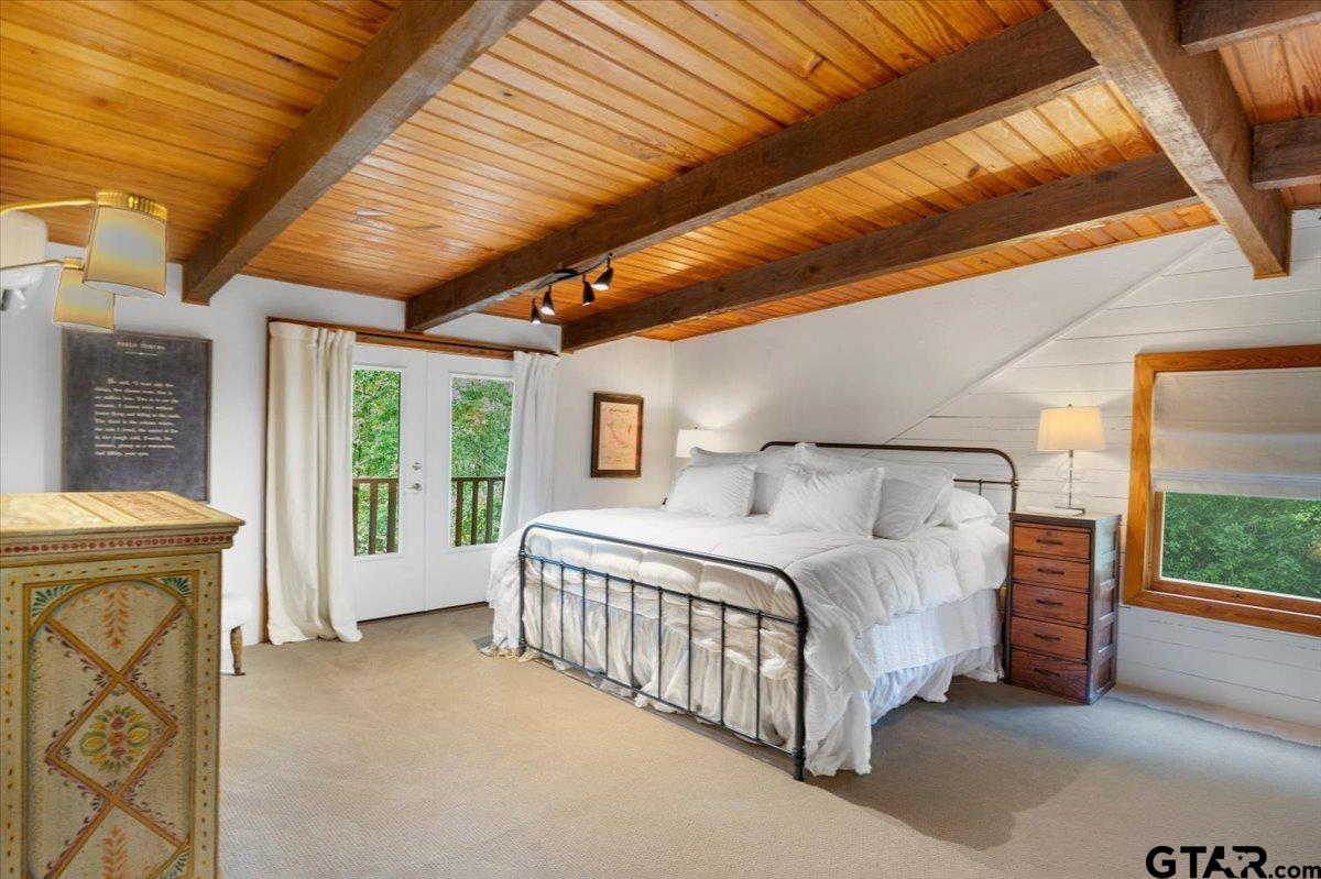 220 Dale Drive Avinger, TX 75630 - Photo 20 of 32 a spacious bedroom with a bed and a large window