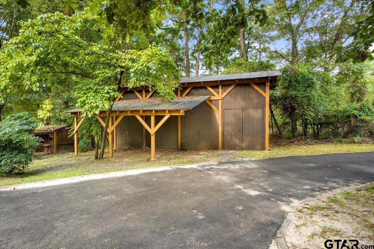 220 Dale Drive Avinger, TX 75630 - Photo 26 of 32 a front view of a house with a yard and garage