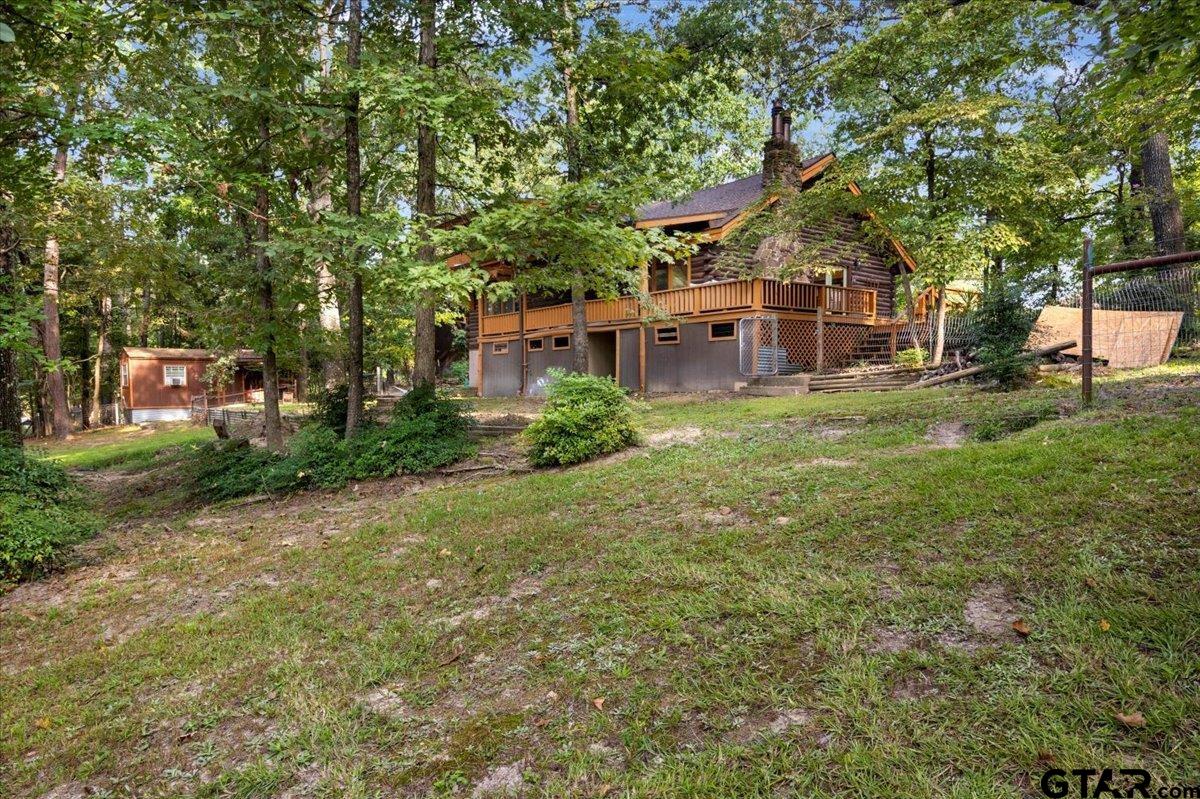 220 Dale Drive Avinger, TX 75630 - Photo 29 of 32 a front view of a house with garden