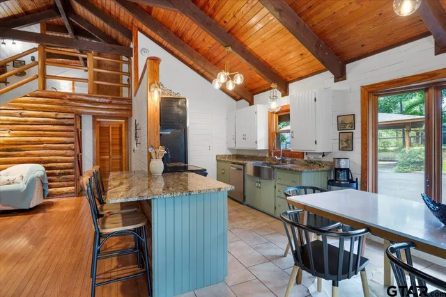 a view of a dining room with furniture and window