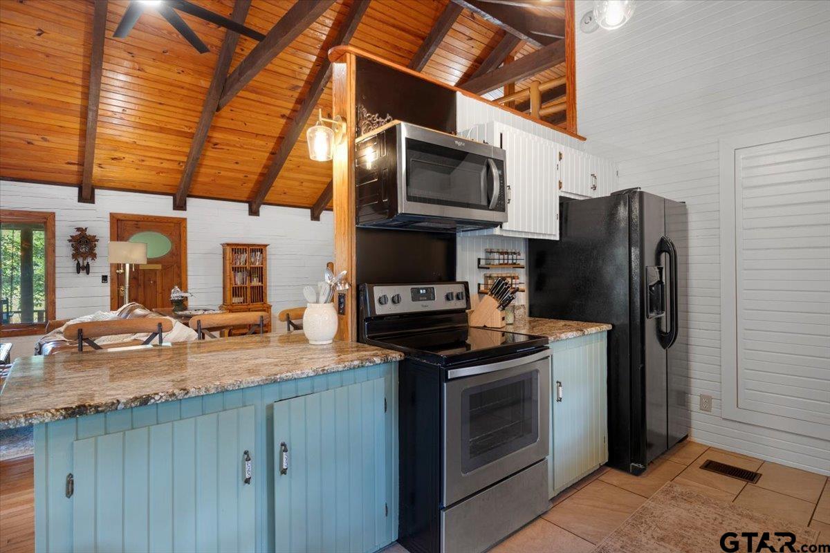 220 Dale Drive Avinger, TX 75630 - Photo 7 of 32 a kitchen with stainless steel appliances granite countertop a refrigerator and a sink