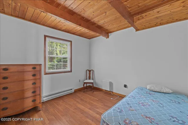 a view of room with wooden floor