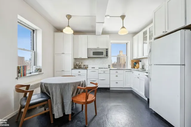 a view of a workspace with furniture