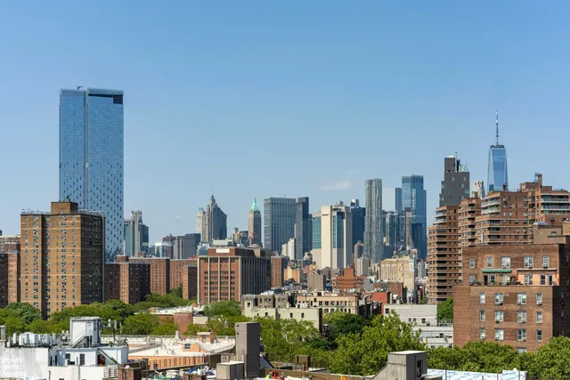 a bathroom with a sink a toilet a mirror a bathtub and shower