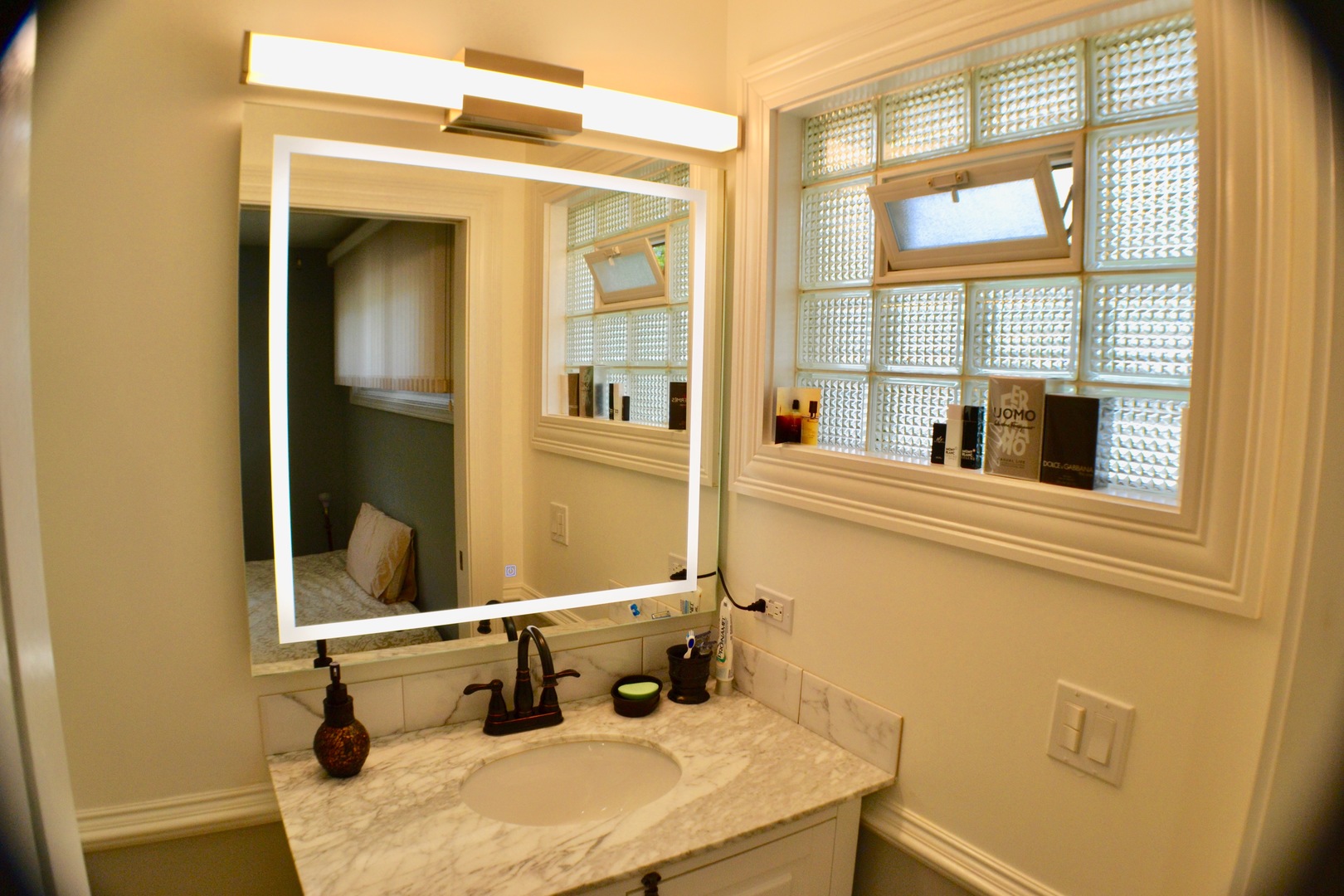 2014 Driving Park Road Wheaton, IL 60187 - Photo 11 of 32 a bathroom with a sink and a mirror