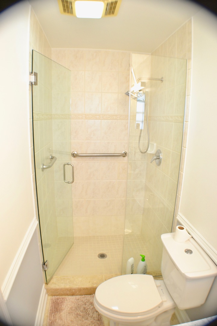 2014 Driving Park Road Wheaton, IL 60187 - Photo 15 of 32 a bathroom with a toilet sink and shower
