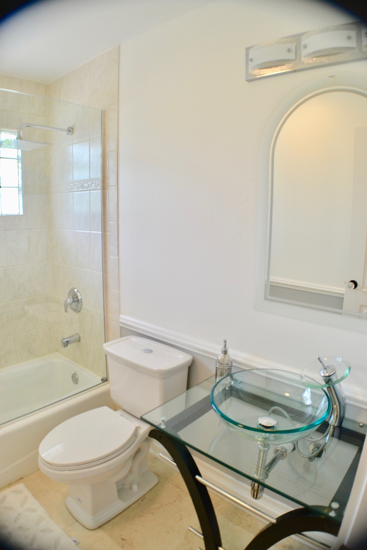 2014 Driving Park Road Wheaton, IL 60187 - Photo 16 of 32 a bathroom with a sink toilet and shower