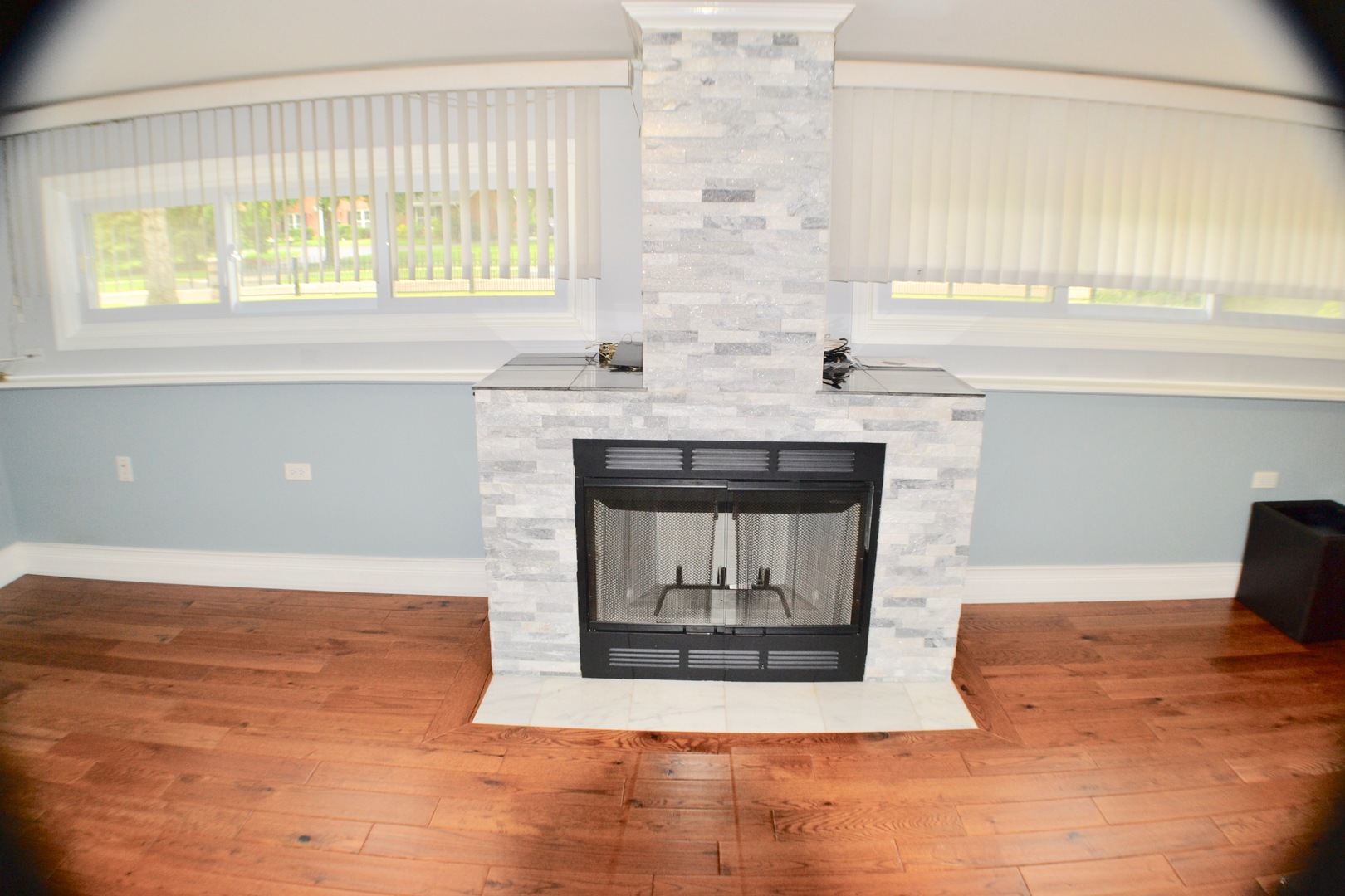 2014 Driving Park Road Wheaton, IL 60187 - Photo 18 of 32 a living room with a fireplace and windows