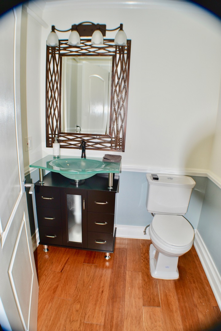 2014 Driving Park Road Wheaton, IL 60187 - Photo 20 of 32 a bathroom with a toilet mirror vanity and vanity