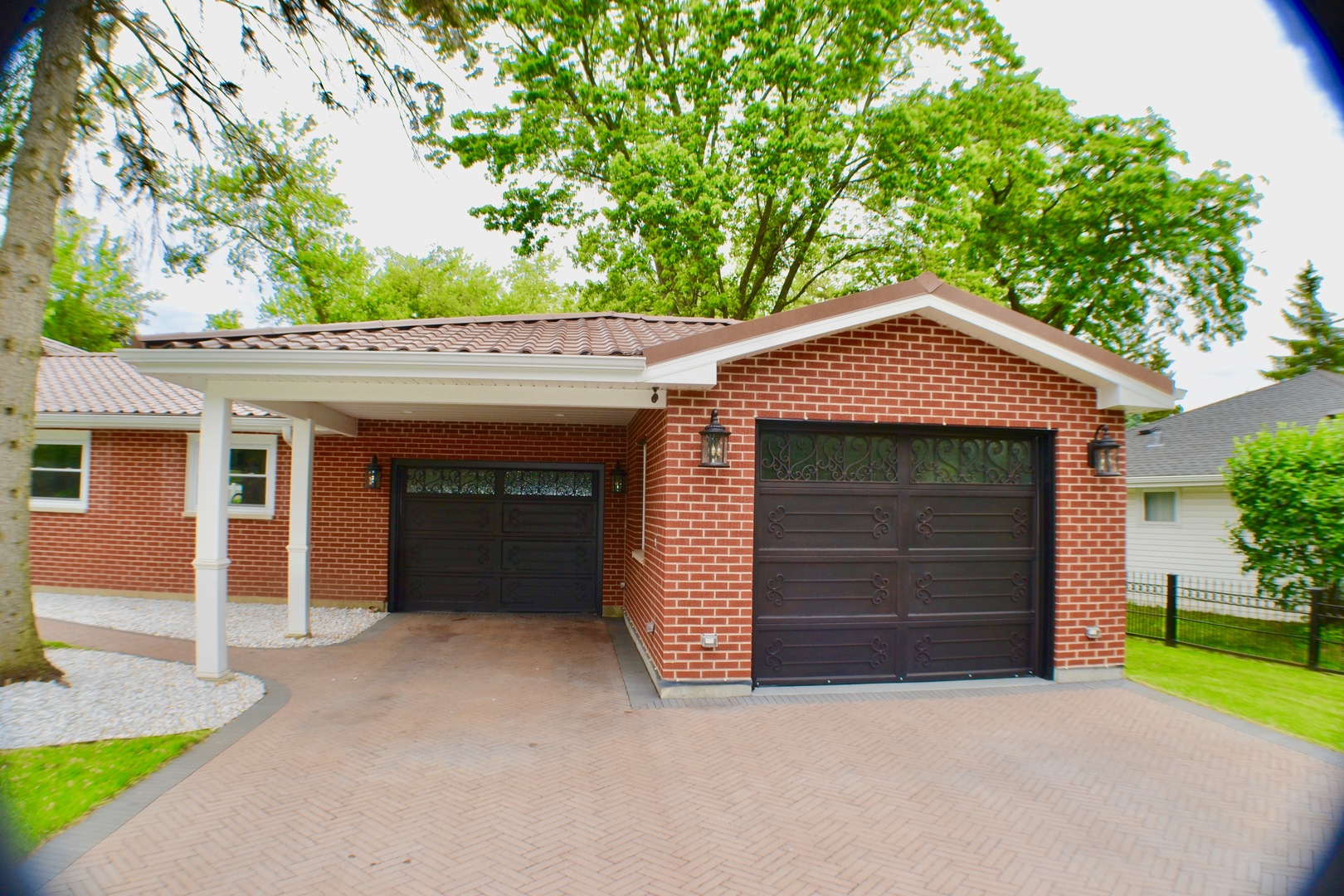 2014 Driving Park Road Wheaton, IL 60187 - Photo 3 of 32 a front view of a house with a yard and garage