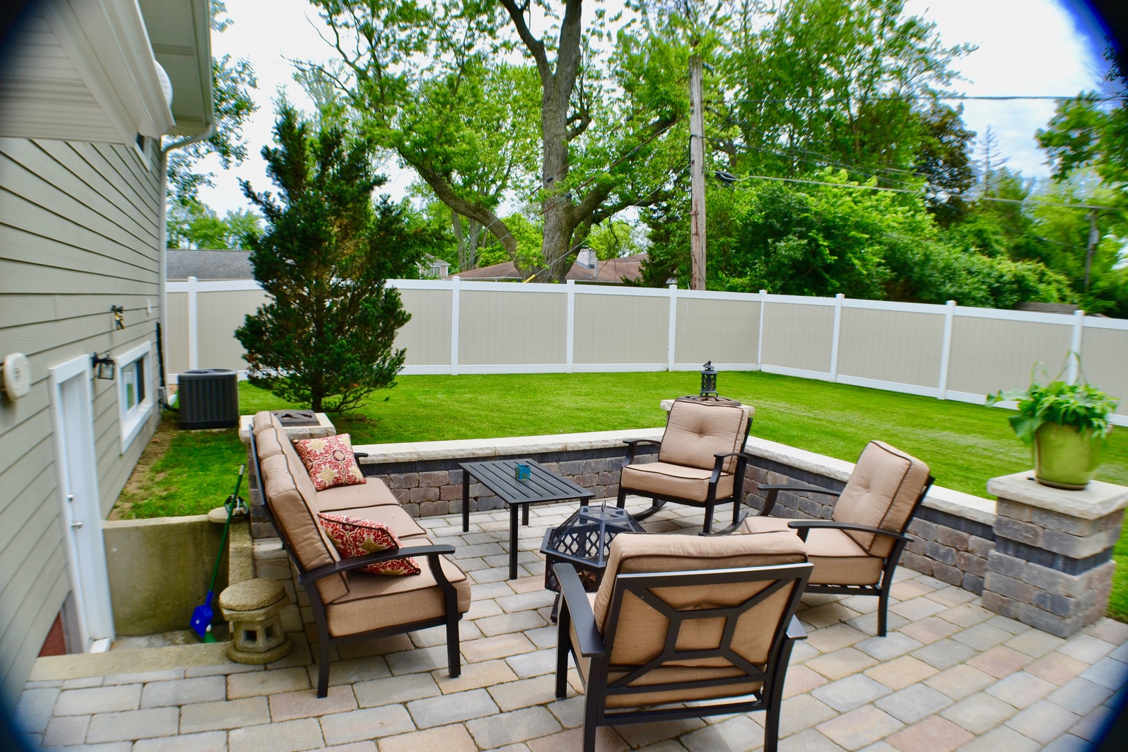 2014 Driving Park Road Wheaton, IL 60187 - Photo 28 of 32 a view of a patio with table and chairs potted plants and a palm tree