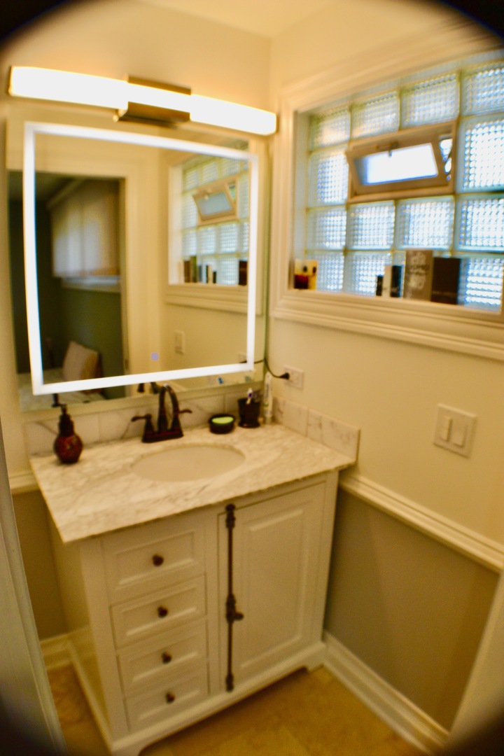 2014 Driving Park Road Wheaton, IL 60187 - Photo 10 of 32 a bathroom with a sink and a mirror