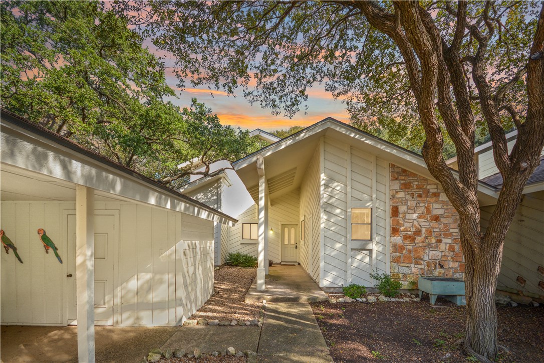 a bathroom with a tree in front of it