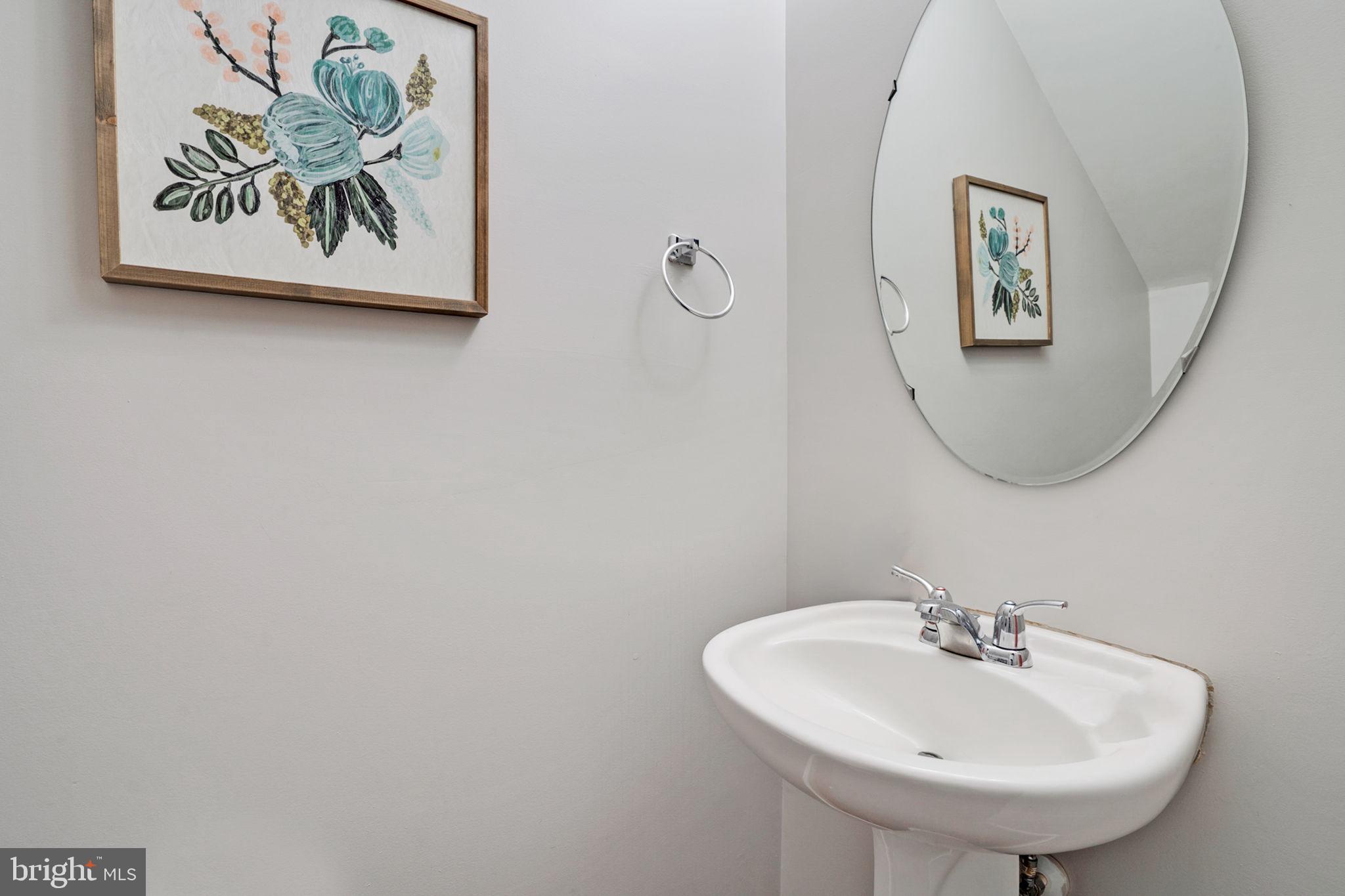9835 Maitland Loop Bristow, VA 20136 - Photo 14 of 41 a bathroom with a sink and a mirror