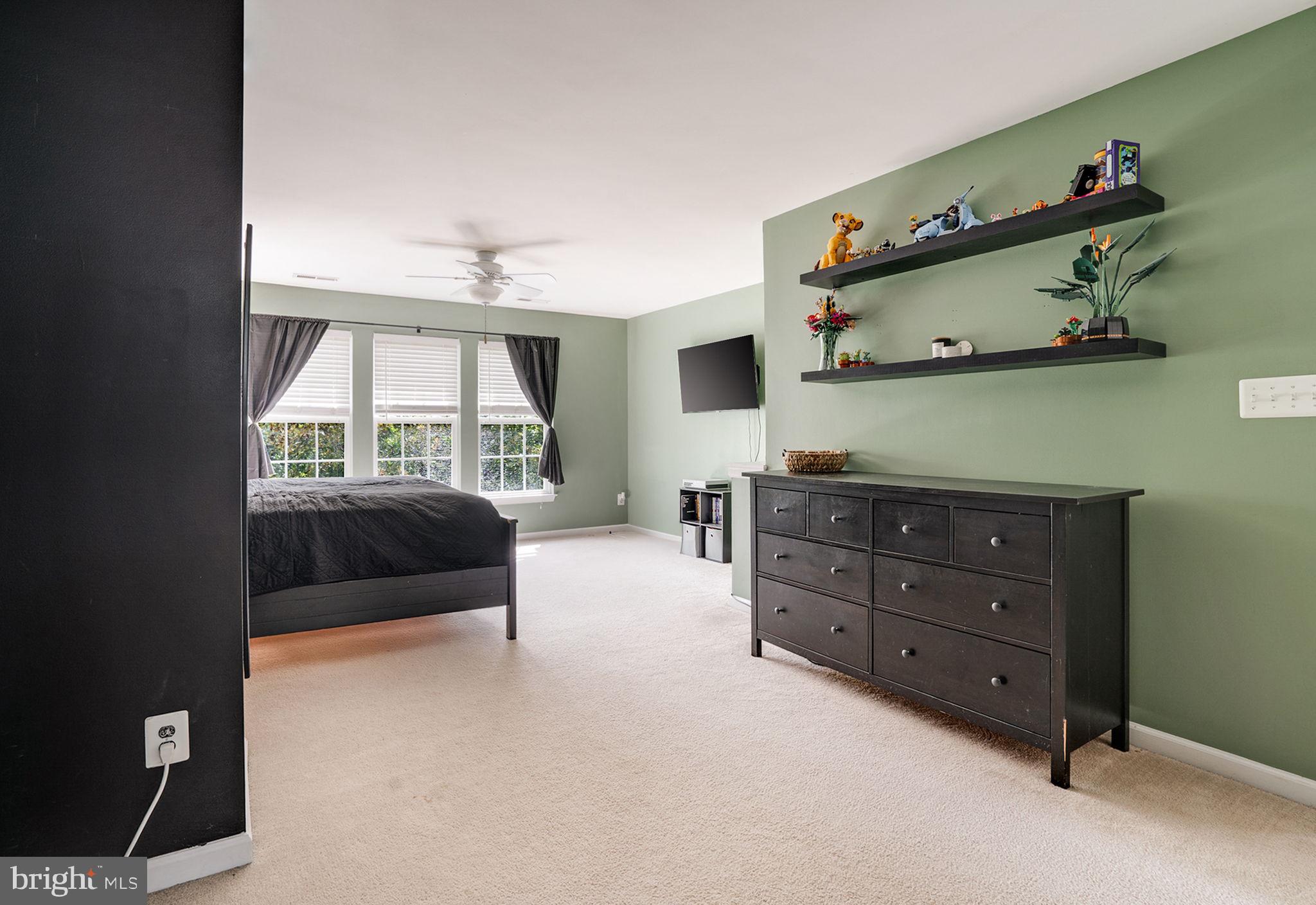 9835 Maitland Loop Bristow, VA 20136 - Photo 16 of 41 a bedroom with a bed and a window