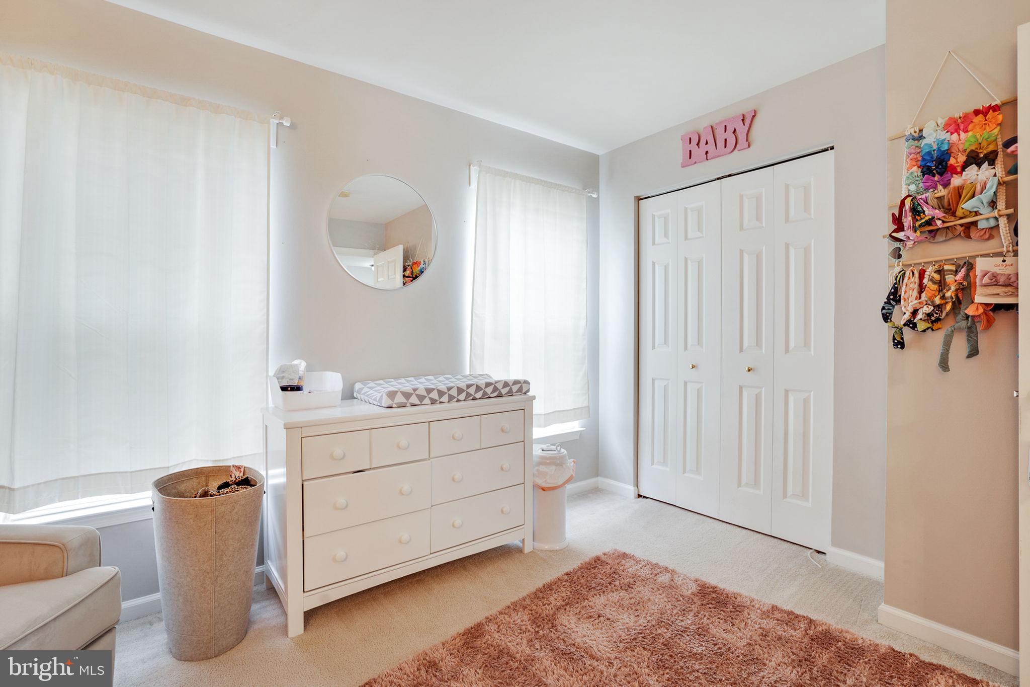 9835 Maitland Loop Bristow, VA 20136 - Photo 27 of 41 a room with a baby crib furniture and a window
