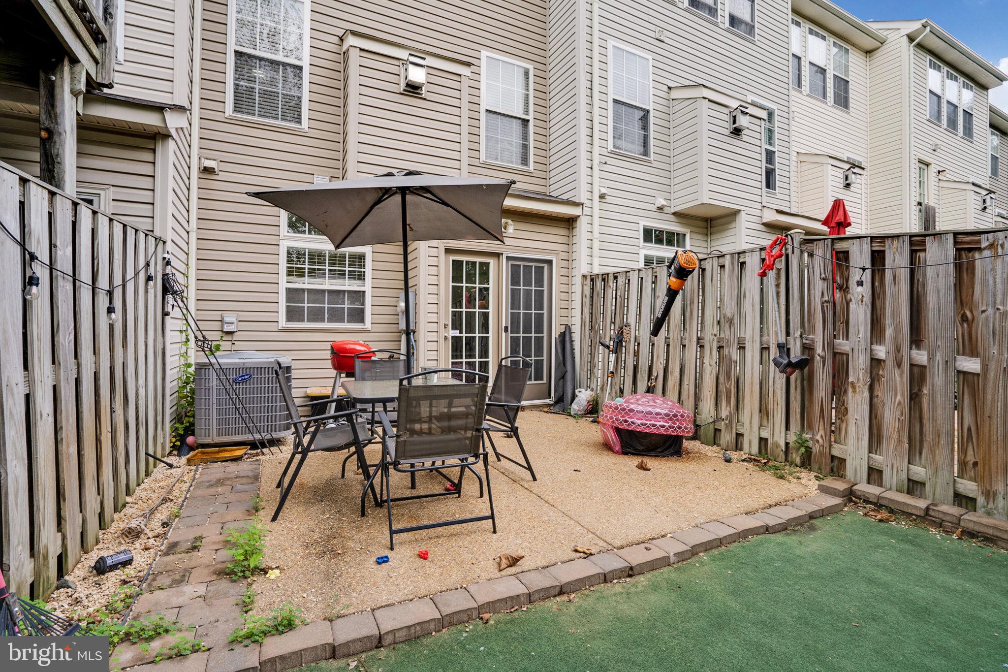 9835 Maitland Loop Bristow, VA 20136 - Photo 35 of 41 a patio with table and chairs