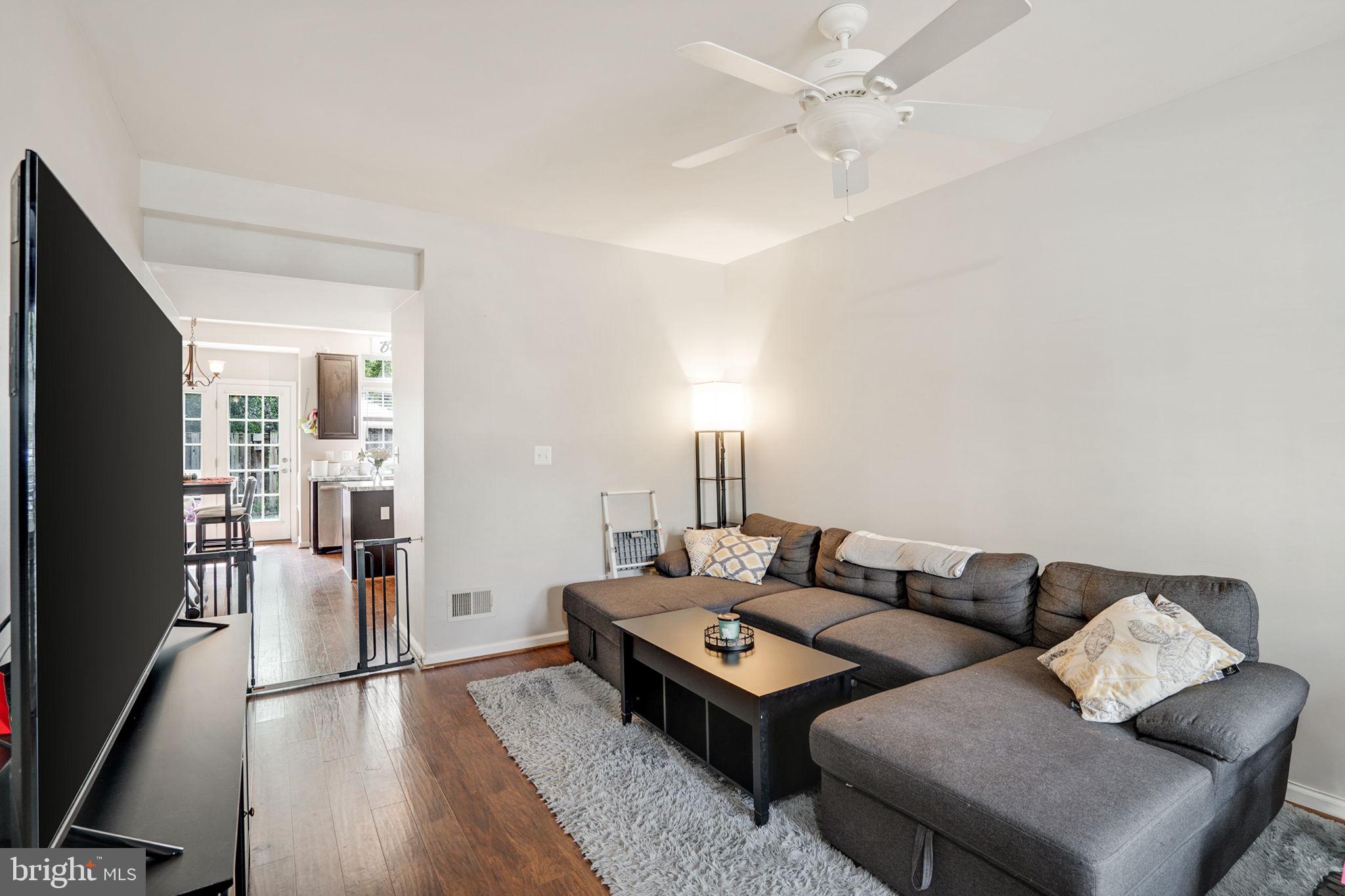 9835 Maitland Loop Bristow, VA 20136 - Photo 4 of 41 a living room with furniture and a table