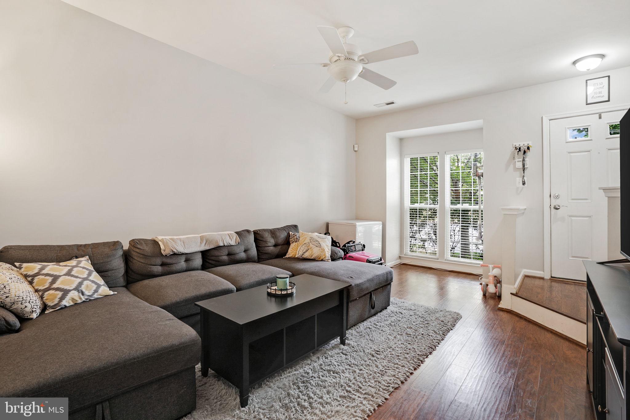 9835 Maitland Loop Bristow, VA 20136 - Photo 5 of 41 a living room with furniture and wooden floor