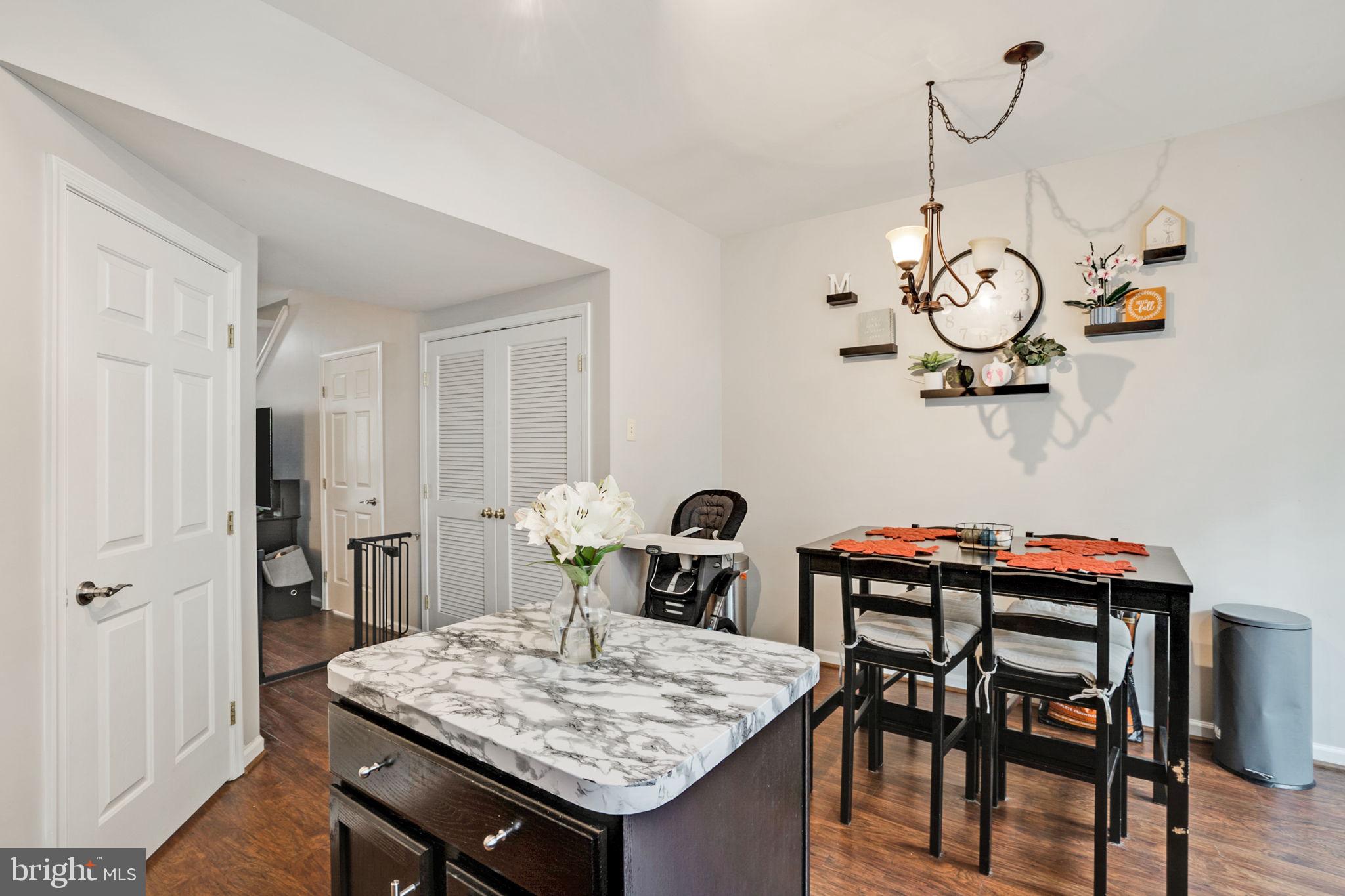9835 Maitland Loop Bristow, VA 20136 - Photo 8 of 41 a table and chairs in a room