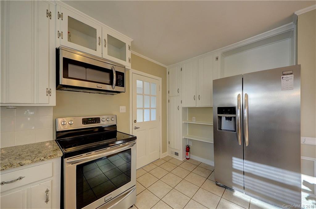 4301 Applegate Road Charlotte, NC 28209 - Photo 13 of 30 a kitchen with cabinets and steel stainless steel appliances