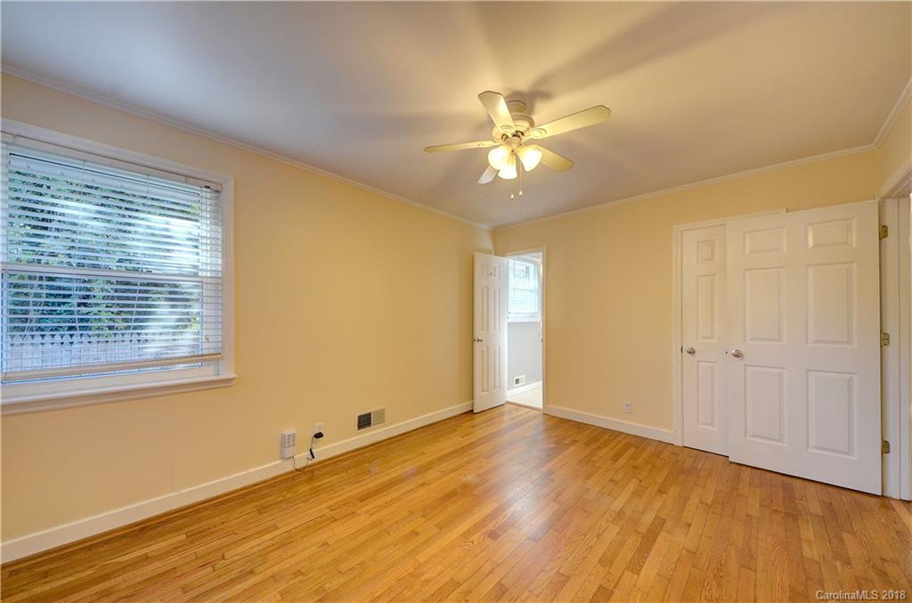 4301 Applegate Road Charlotte, NC 28209 - Photo 17 of 30 a view of an empty room with wooden floor and a window
