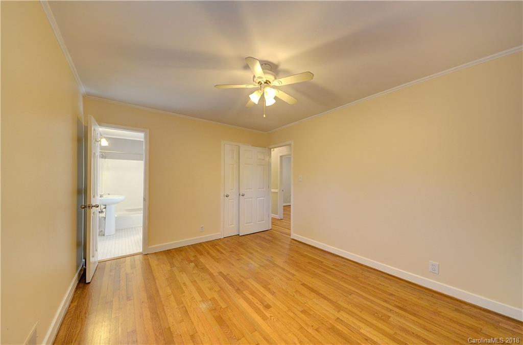 4301 Applegate Road Charlotte, NC 28209 - Photo 18 of 30 a view of a room with wooden floor and a ceiling fan