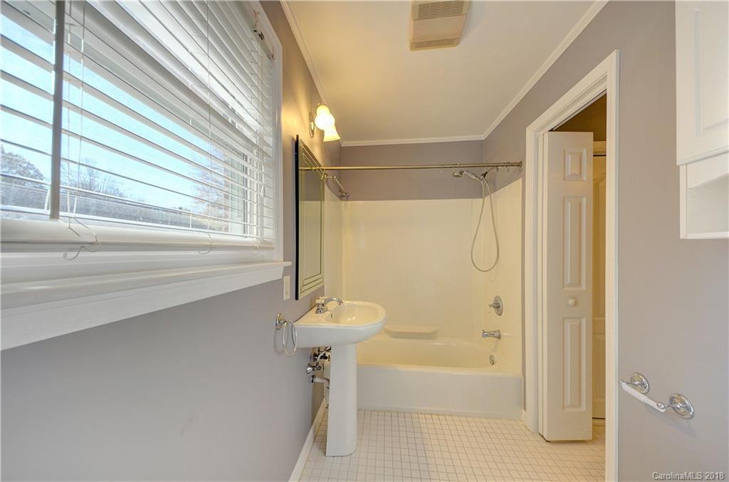 4301 Applegate Road Charlotte, NC 28209 - Photo 19 of 30 a bathroom with a shower and a bathtub