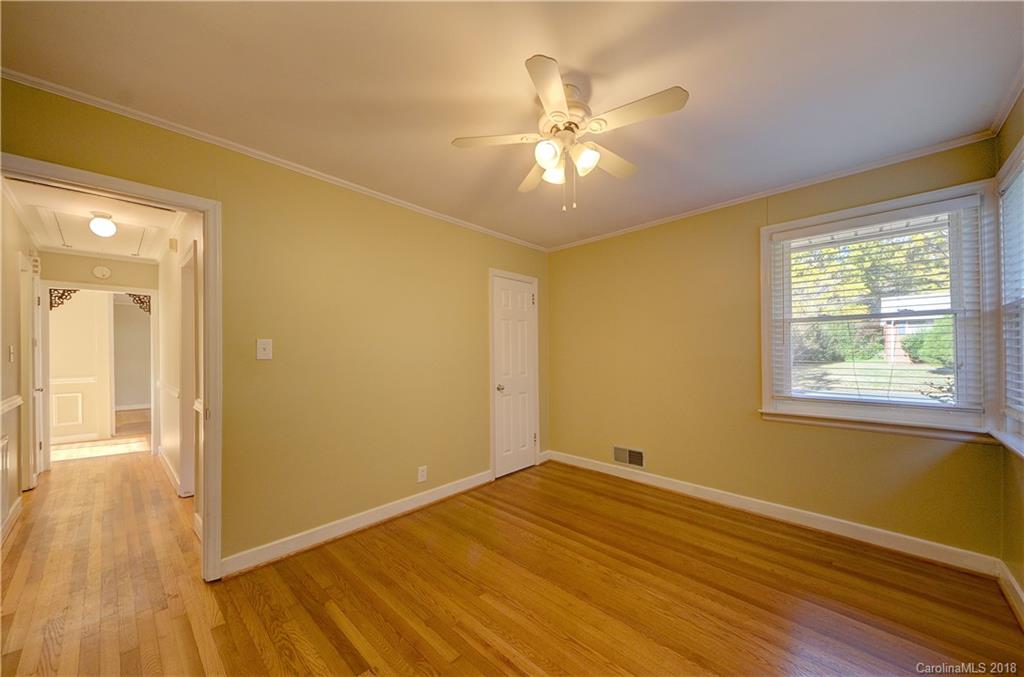 4301 Applegate Road Charlotte, NC 28209 - Photo 22 of 30 a view of empty room with wooden floor and fan