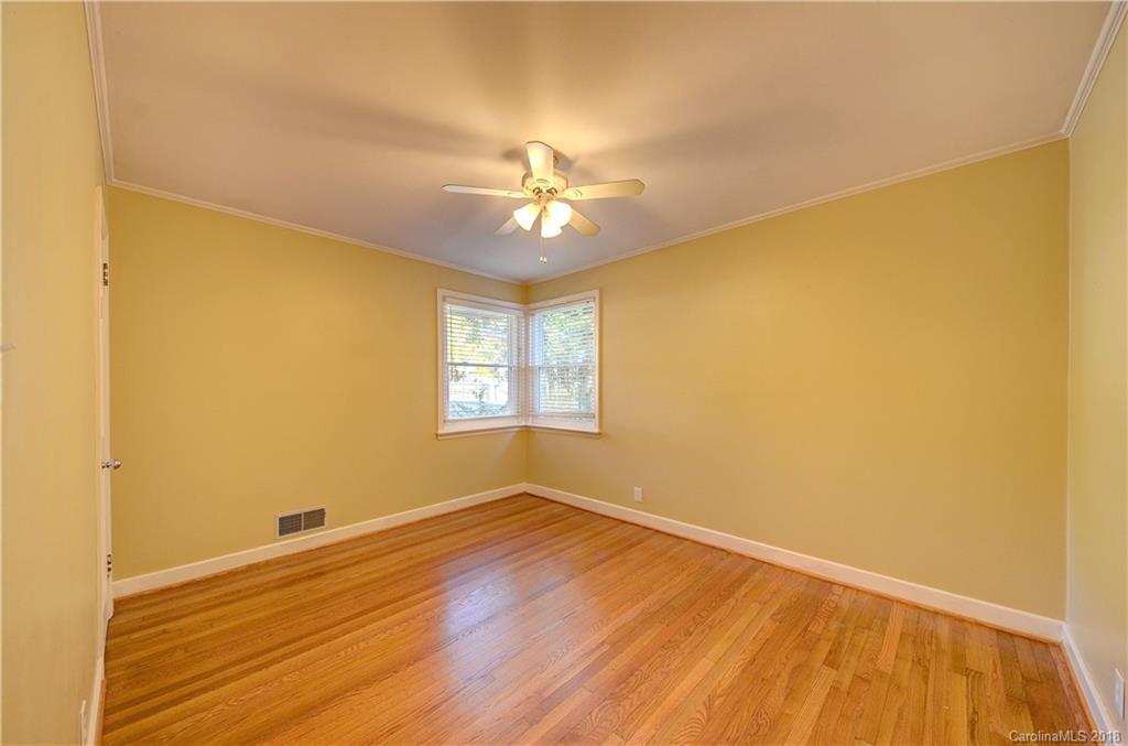 4301 Applegate Road Charlotte, NC 28209 - Photo 24 of 30 a view of a room with a wooden floor and a ceiling fan