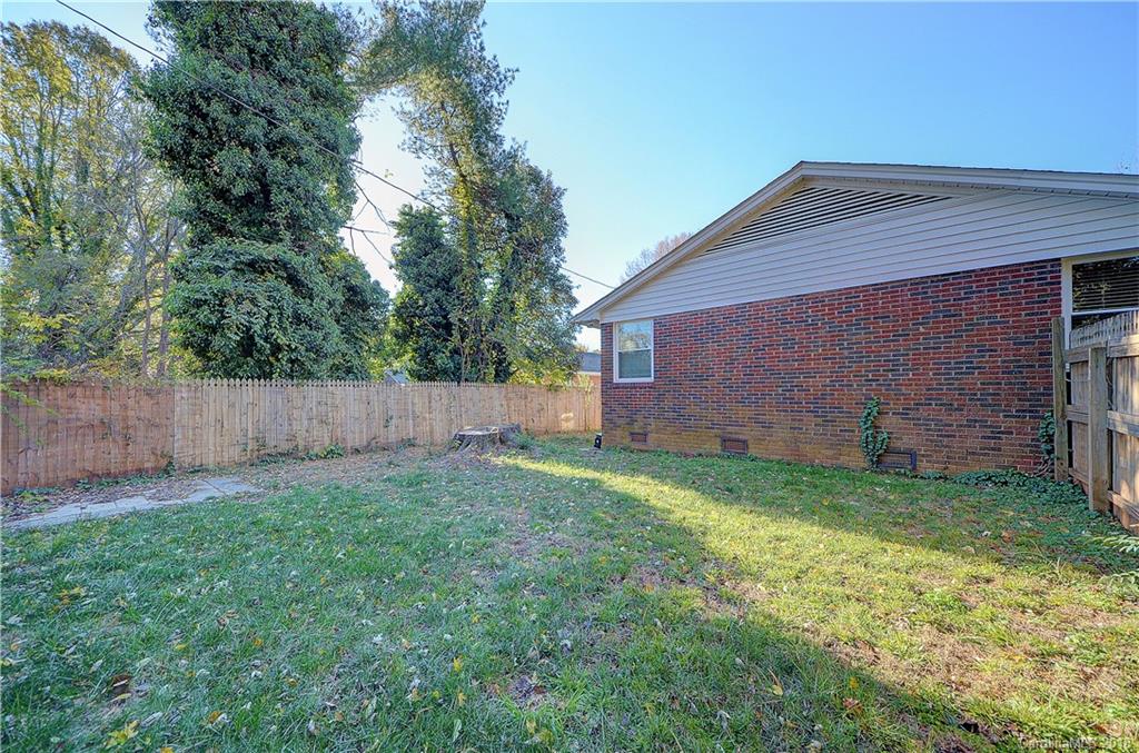 4301 Applegate Road Charlotte, NC 28209 - Photo 29 of 30 a view of a backyard with potted plants and large tree