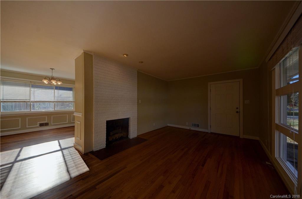 4301 Applegate Road Charlotte, NC 28209 - Photo 7 of 30 a view of an empty room with wooden floor and a window