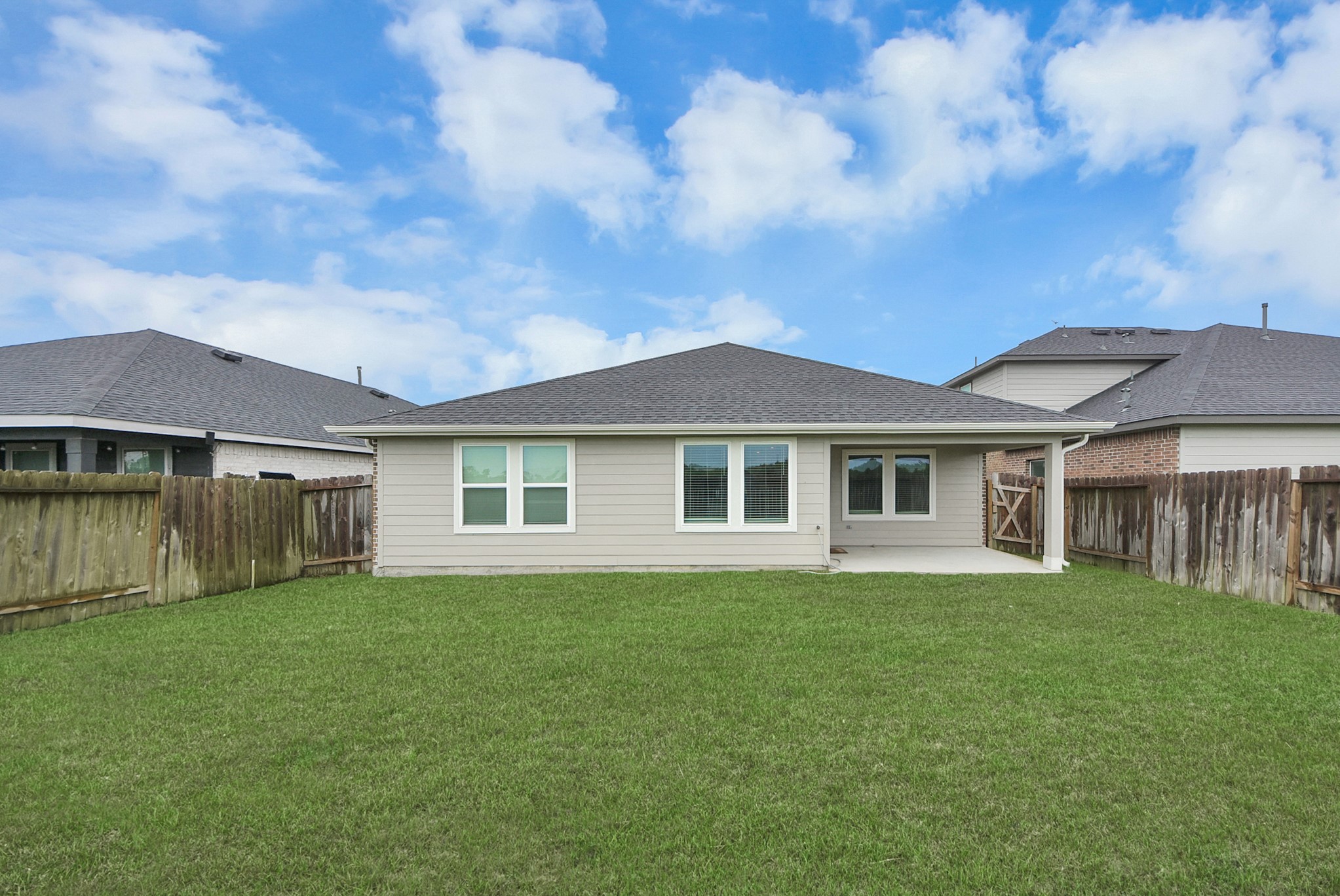 7911 Wrangler Shack Lane Rosharon, TX 77583 - Photo 39 of 40 Charming single-story home with a spacious fenced backyard, perfect for outdoor activities and relaxation, featuring a covered patio ideal for entertaining.