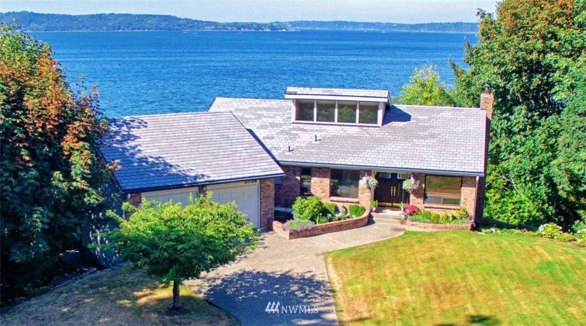 3734 Southwest Dash Point Road Federal Way, WA 98023 - Photo 1 of 1 a front view of a house with a yard