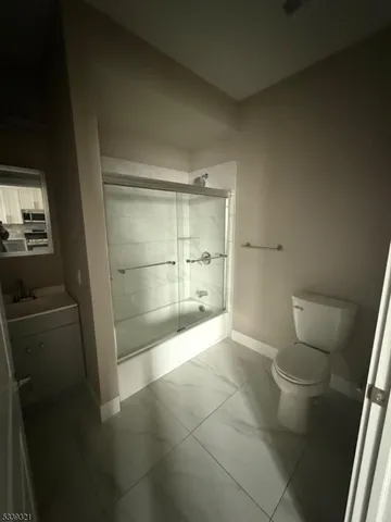 a bathroom with a shower and a toilet