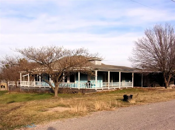 a view of house with outdoor space and swimming pool