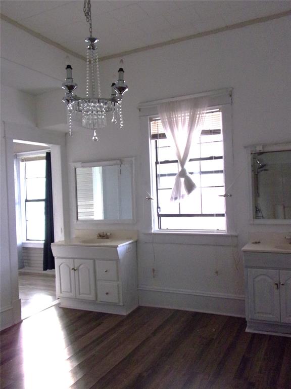 325 C R 100 San Saba, TX 76877 - Photo 12 of 21 a view of an empty room with a window and wooden floor