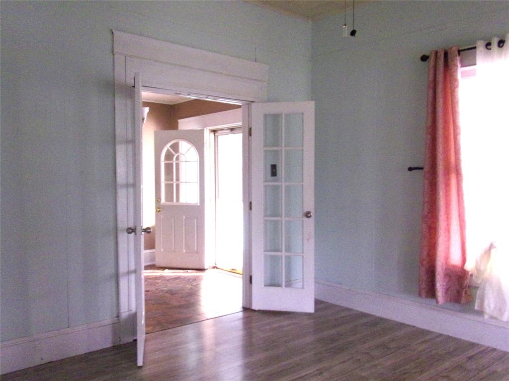 325 C R 100 San Saba, TX 76877 - Photo 13 of 21 a view of a room with wooden floor