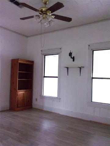 a bathroom with a sink a mirror and a window