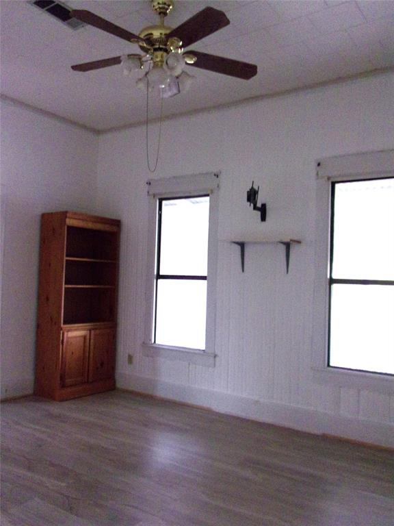 325 C R 100 San Saba, TX 76877 - Photo 15 of 21 a view of an empty room with a window and wooden floor