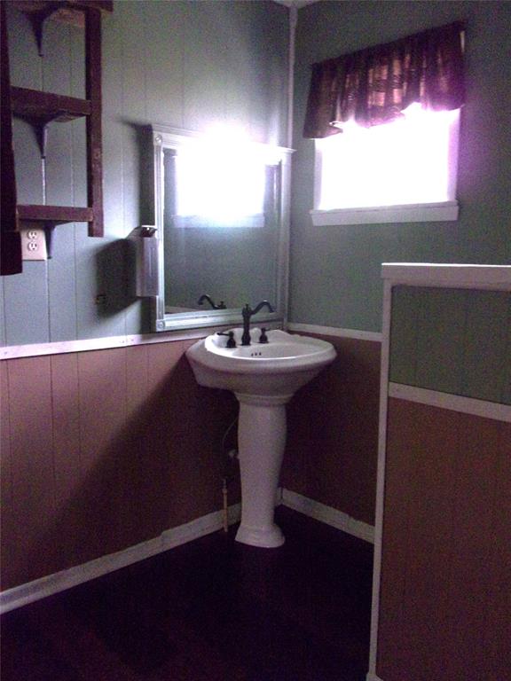 325 C R 100 San Saba, TX 76877 - Photo 16 of 21 a bathroom with a sink a mirror and a window