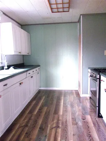 a view of a hallway with chandelier