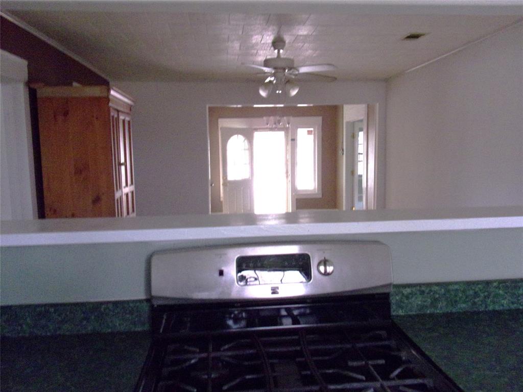 325 C R 100 San Saba, TX 76877 - Photo 18 of 21 a view of a hallway with chandelier