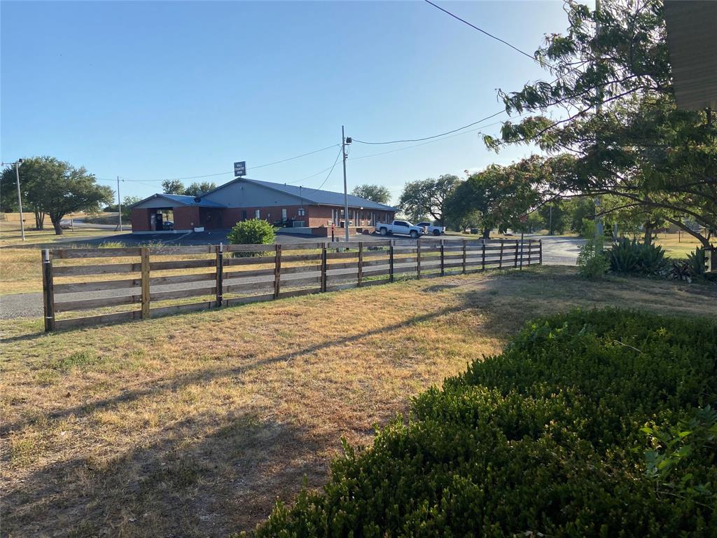 325 C R 100 San Saba, TX 76877 - Photo 20 of 21 a view of a yard with a bench